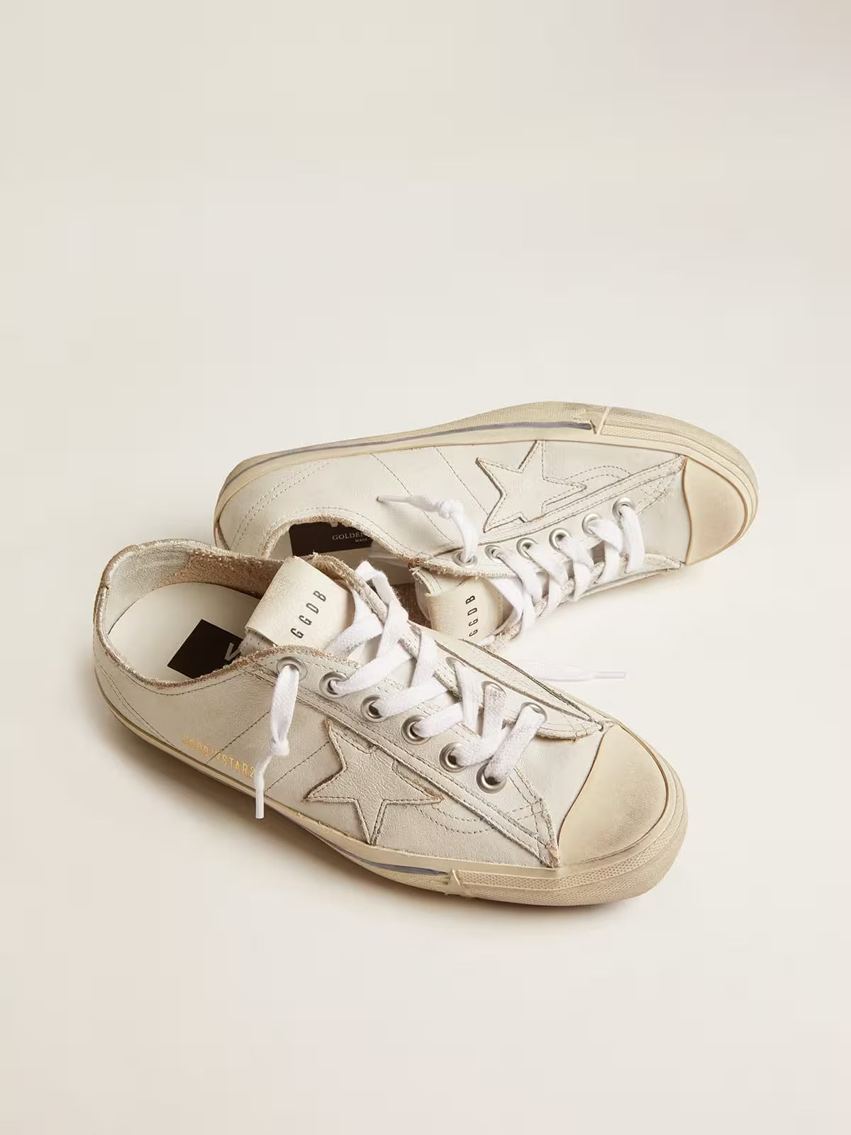 Golden Goose V-Star in white leather with white star and light blue stripe on the foxing
