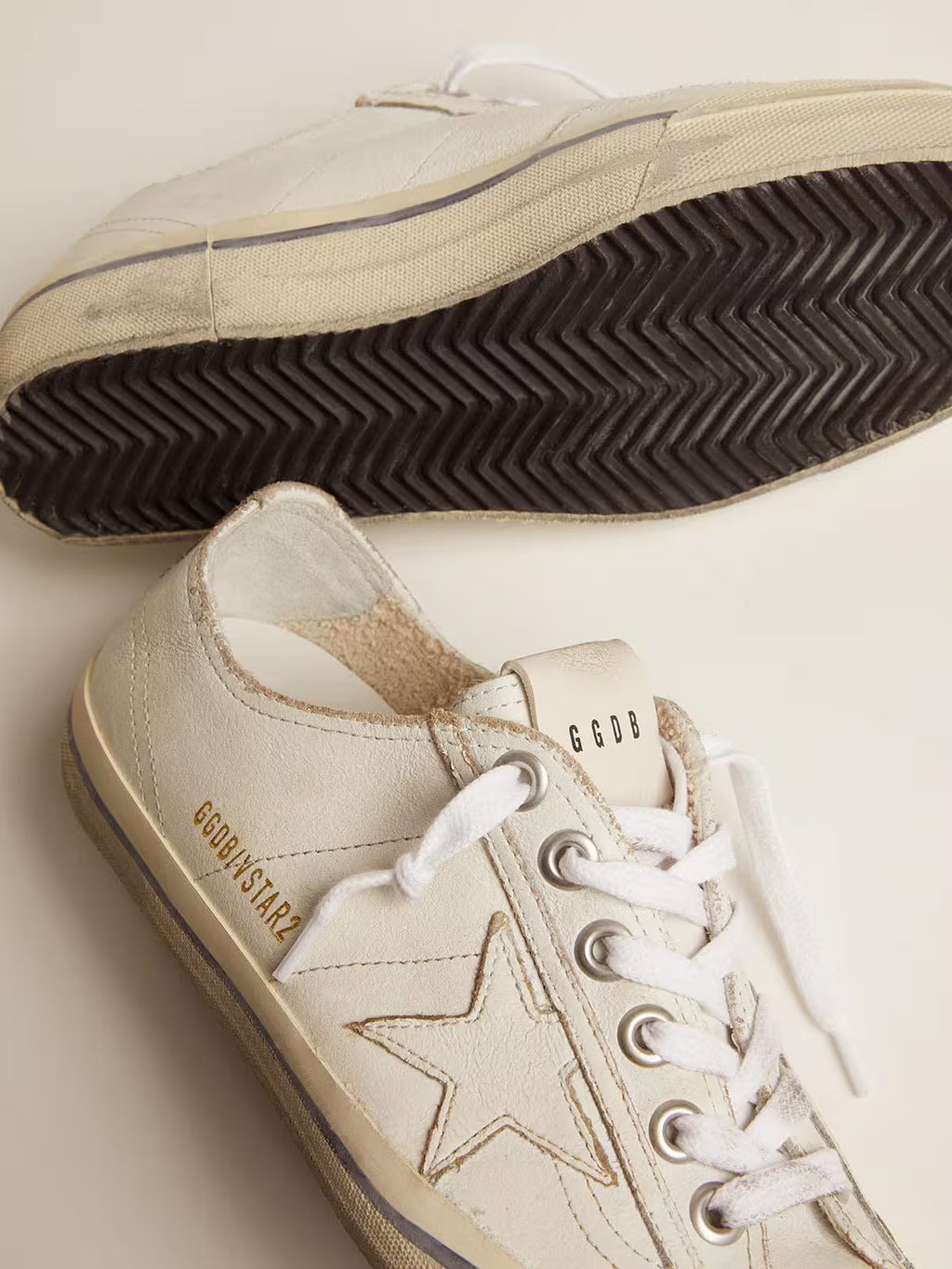 Golden Goose V-Star in white leather with white star and light blue stripe on the foxing