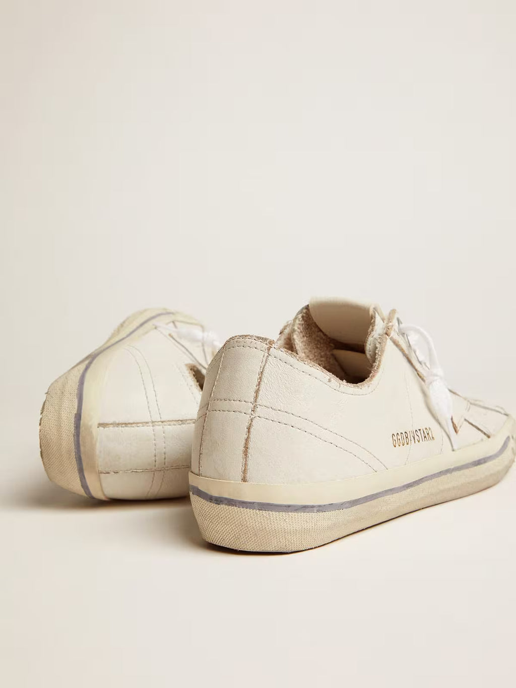 Golden Goose V-Star in white leather with white star and light blue stripe on the foxing
