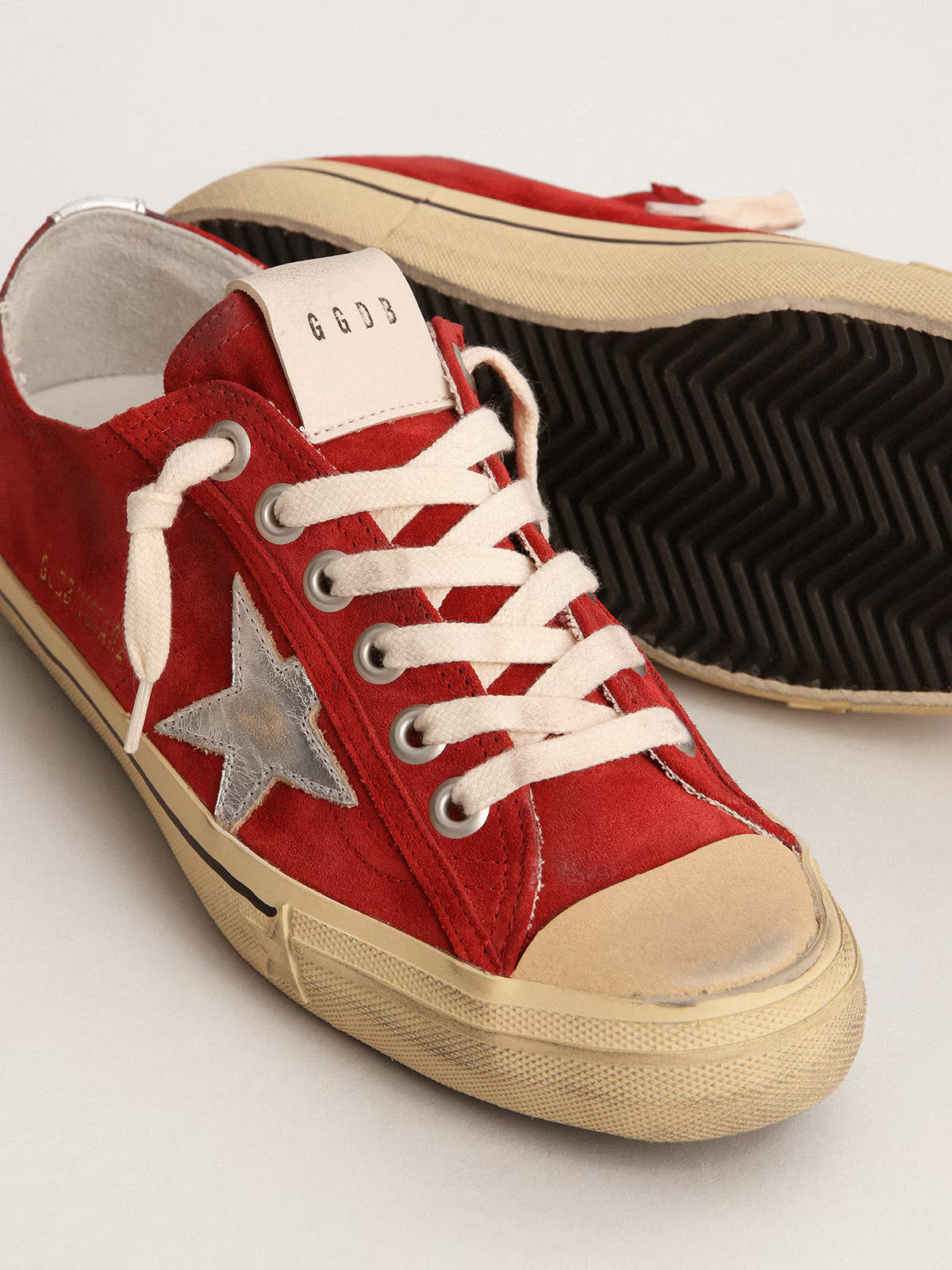 Golden Goose V-Star in dark red suede with silver star and heel tab