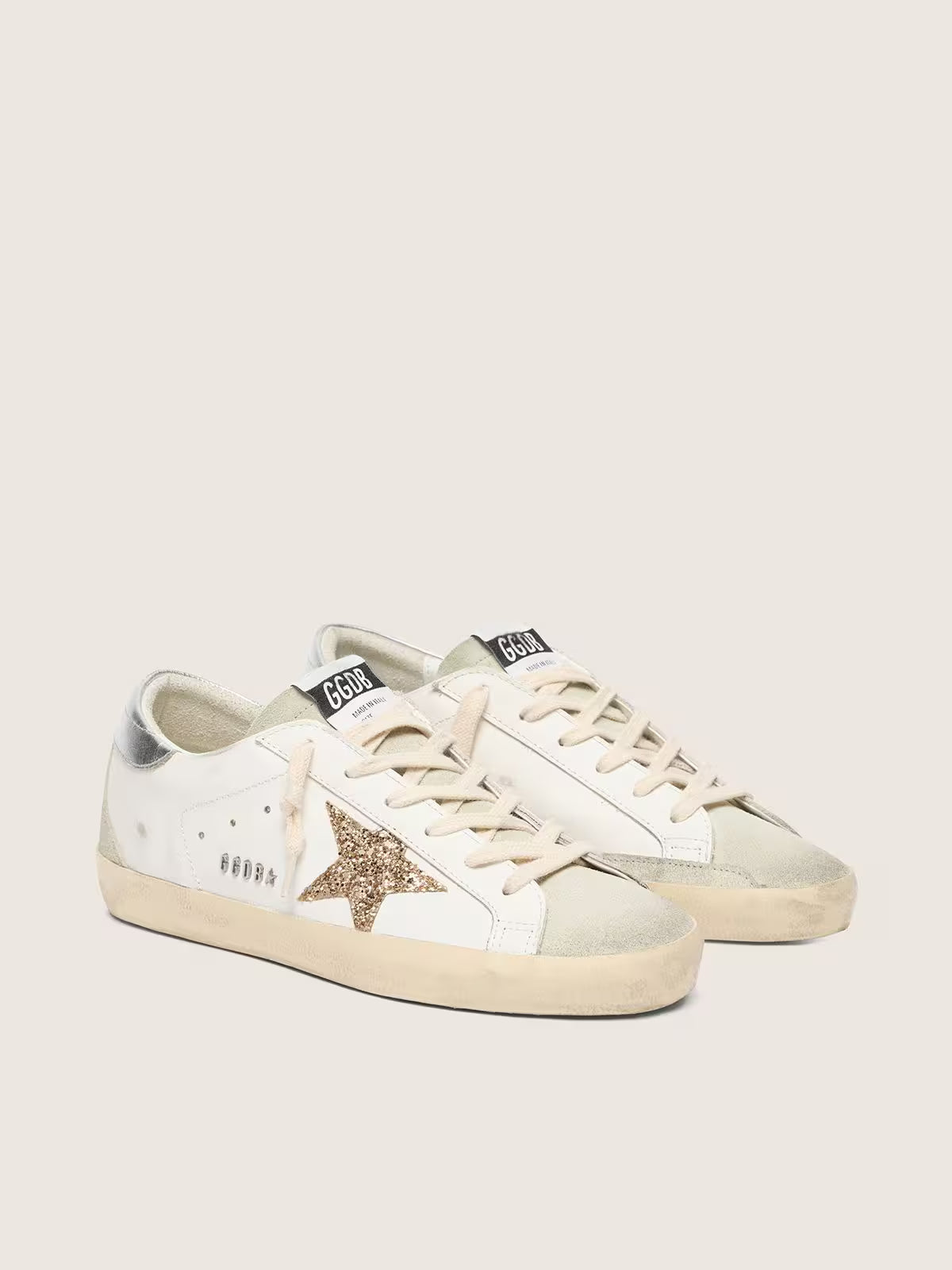 Golden Goose Super-Star with gold glitter star and ice-gray suede inserts