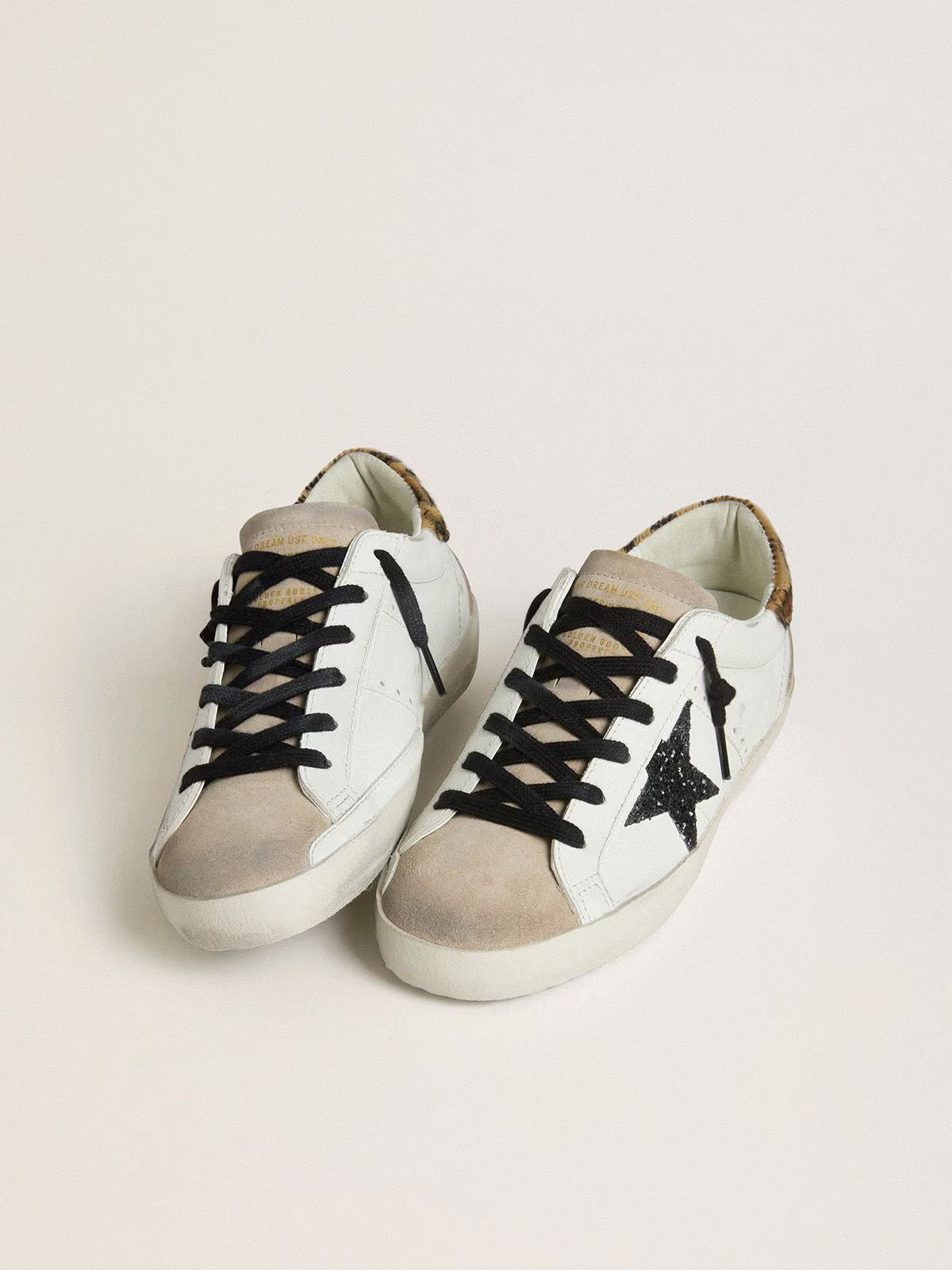 Golden Goose Super-Star with black glitter star and leopard-print pony skin heel tab