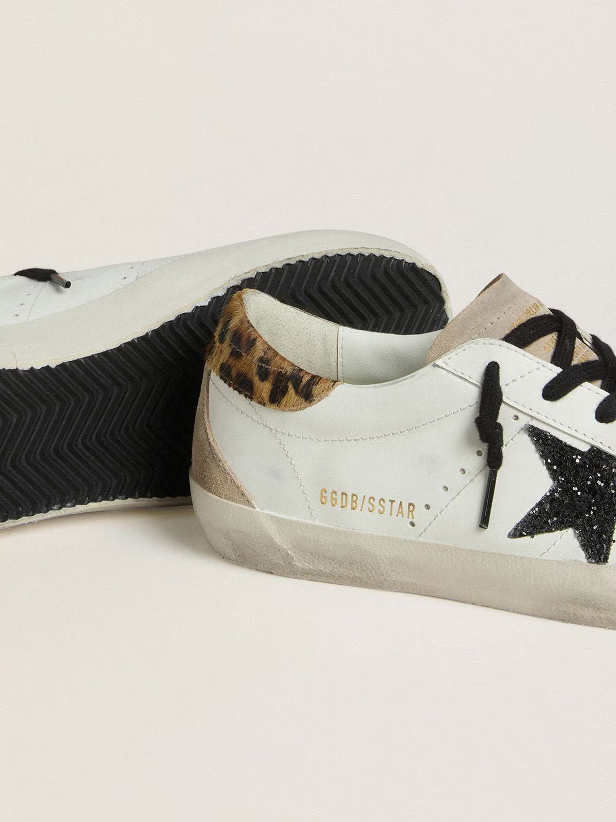 Golden Goose Super-Star with black glitter star and leopard-print pony skin heel tab