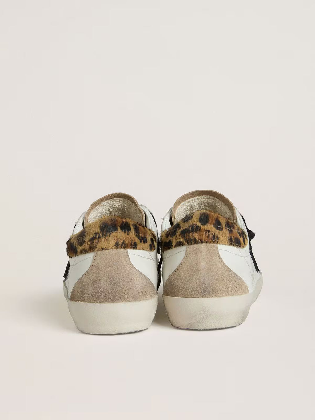 Golden Goose Super-Star with black glitter star and leopard-print pony skin heel tab
